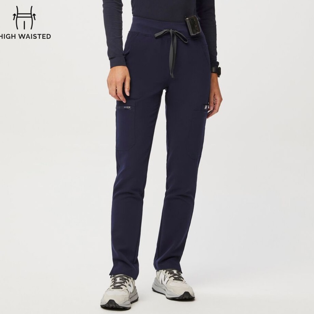 Navy Figs scrub pants with bright orange ties (not pictured)